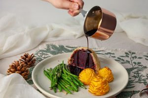 Beetroot wellington served with balsamic sauce, pomme duchesse, and green beans