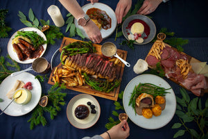 Table full of luxurious starters, mains and desserts