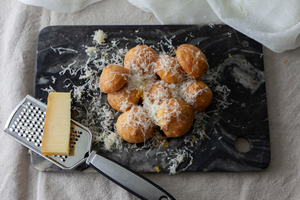 Gruyere Gourgères topped with finely grated gruyere