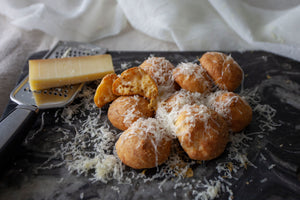 Gruyere Gourgères topped with finely grated gruyere