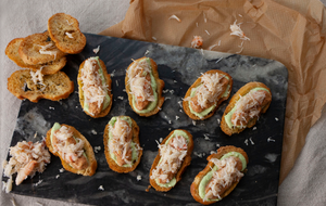 Crab & avocado on melba toast served as canape