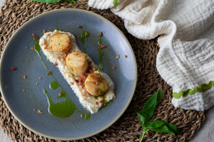 Scallops with artichoke puree, bacon crumb and basil oil