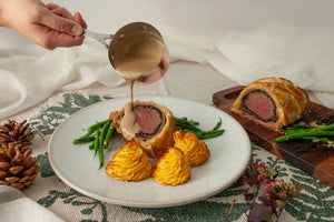 Venison wellington served with green beans, Pomme Ducheese and Marsala sauce