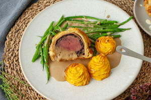 Venison wellington served with green beans, Pomme Ducheese and Marsala sauce