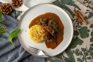 Lamb shank curry served with saffron rice and lemon posset with homemade shortbread for dessert