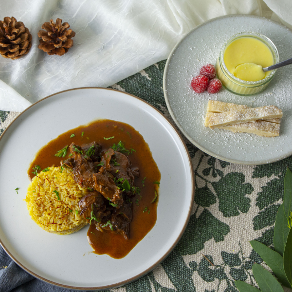 Lamb shank curry served with saffron rice and lemon posset with homemade shortbread for dessert
