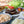 Load image into Gallery viewer, Gloucester Old Spot Sausages sausages and old cow burgers served with brioche buns, finger rolls, apple and carrot slaw, onions and cabbage toppings, grated gruyere cheese and fresh lettuce and tomatoes
